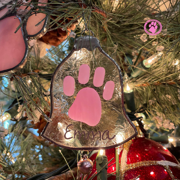 Pink paw ornament in christmas tree